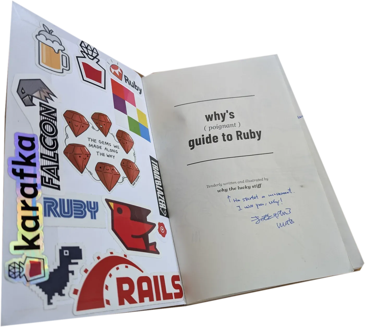 The guest book itself, lying open: the inside cover full of Ruby stickers on the left, the title page on the right with matz's note, He started a movement. I miss you, why!